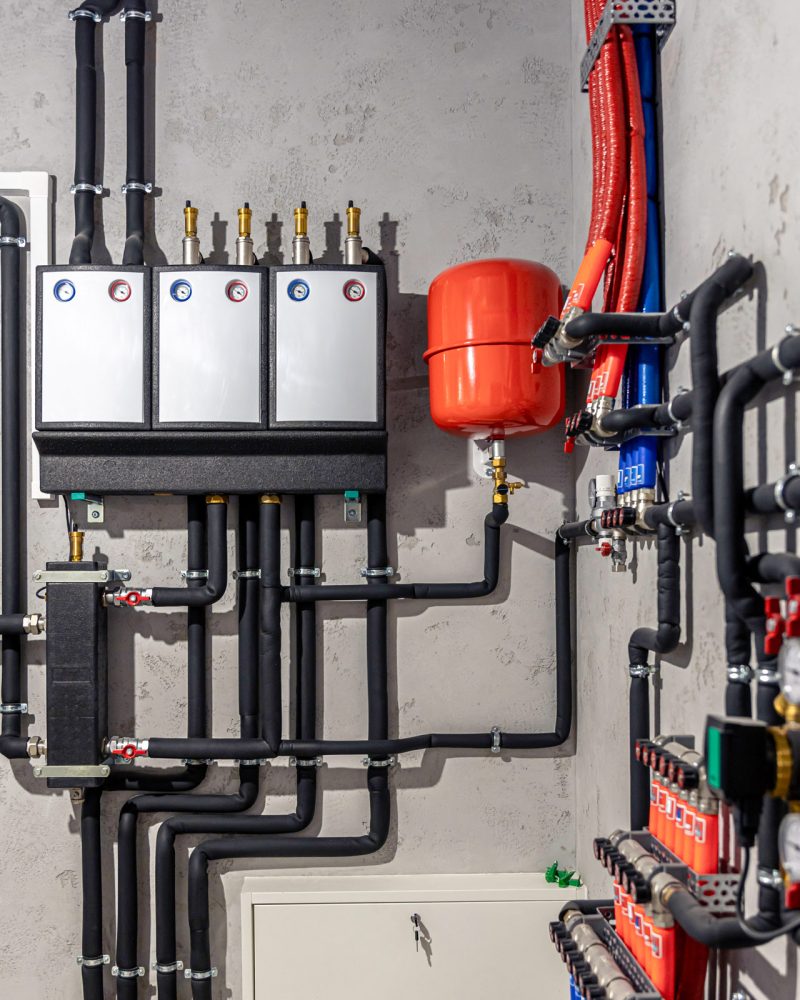 A modern electric boiler room. Equipment for modern heating system as a boiler, heater,pipes, expansion tank and other.